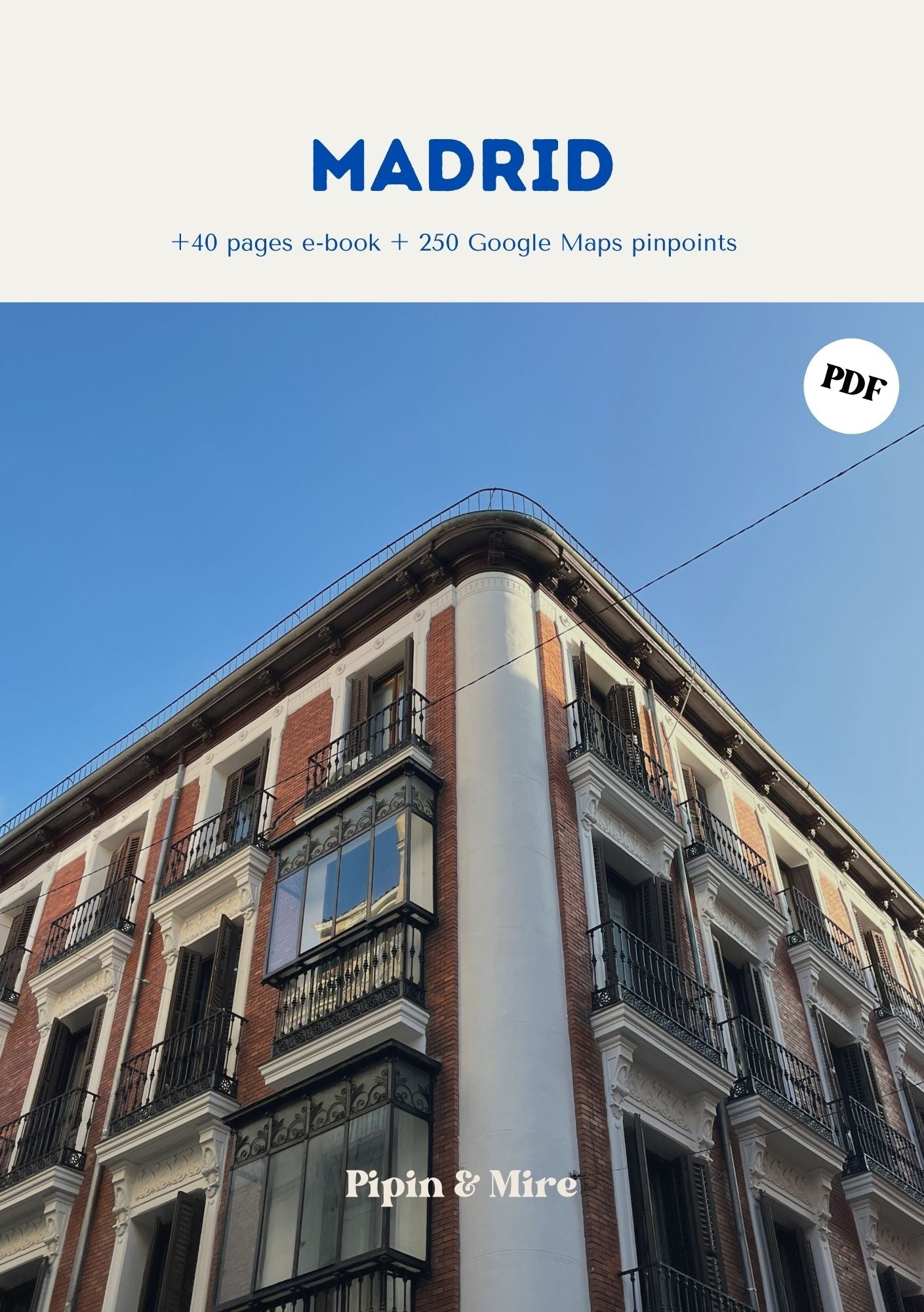 Portada de la guía de Madrid de Pipin & Mire con un edificio clásico de balcones de hierro