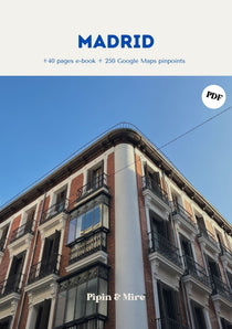 Portada de la guía de viaje de Madrid en PDF de Pipin & Mire, con un edificio clásico de ladrillo